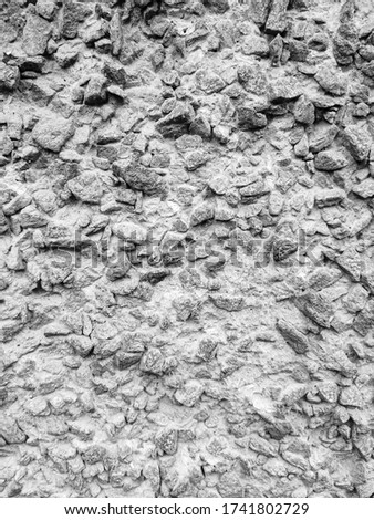 Stone background.  Little stones in concrete, gray color.  Texture for design