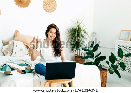 The video blogger is broadcasting on the Internet. Communication in social networks. Video chat in quarantine. Skype chat with friends, distance learning and online work. Home office. Royalty-Free Stock Photo #1741814891