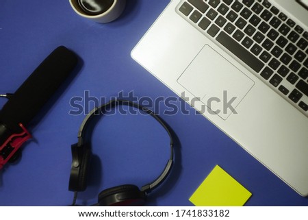 Recording podcast set. Headphones, microphone and laptop flat lay. Cup of coffee. Home studio concept. Blogger equipment 