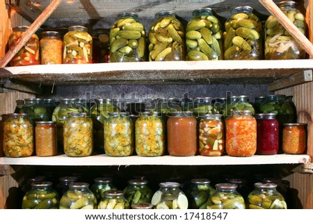 An image of bottles with vegetable in rows