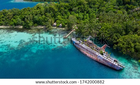Half sunken ship at Roderick Bay in Solomon Islands Royalty-Free Stock Photo #1742000882
