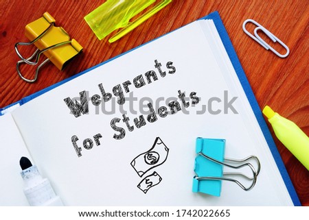 Business concept about Webgrants For Students with sign on the piece of paper.
