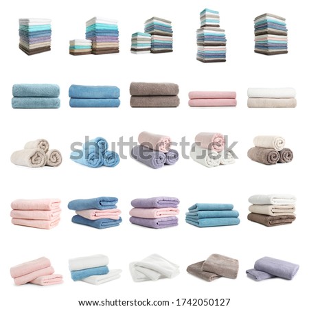 Set of clean soft terry towels on white background