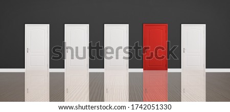 Red door among white ones in room. Concept of choice Royalty-Free Stock Photo #1742051330
