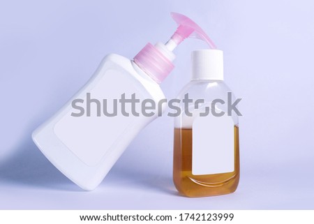 Hand Sanitizer, Hand wash and germs killing liquid bottles isolated on white background with no tag. Corona virus protection bottle set on a white background