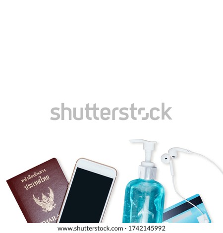 New Normal.COVID-19 prevention and protection,picture of Thailand passport with smartphone,alcohol gel,credit card and Headphones before going out to protect,isolated on white background.