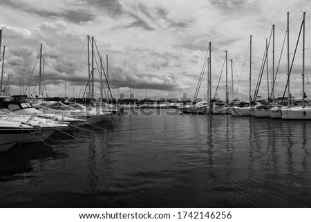 View of the harbor with yachts, boats and blue sky, black and white photography.Holiday, sea, croatia, wallpaper
