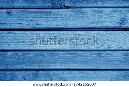 Wooden planks background in navy blue color. Abstract background and texture for design.   