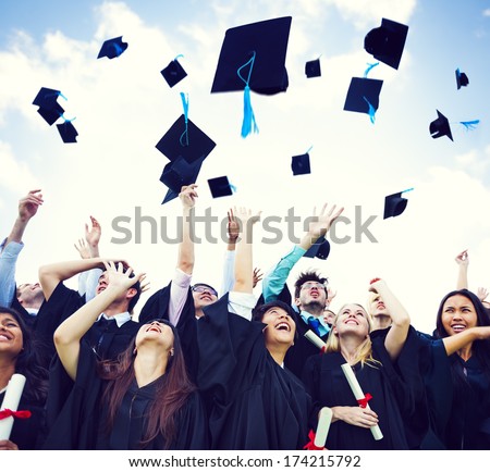 Graduation Caps Thrown in the Air Royalty-Free Stock Photo #174215792