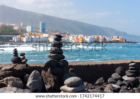 Stone cairns on Puerto de la Cruz coast, Tenerife island, Spain
