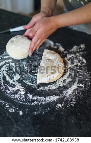 Woman in kitchen making homemade bread