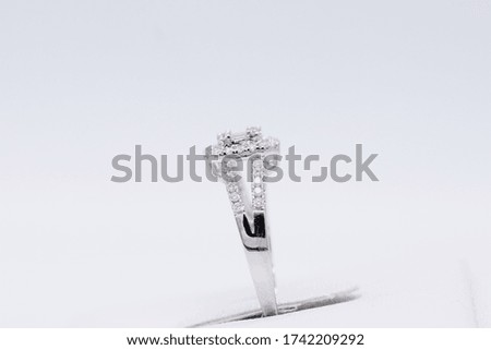 side view diamond ring gold white gold on stand