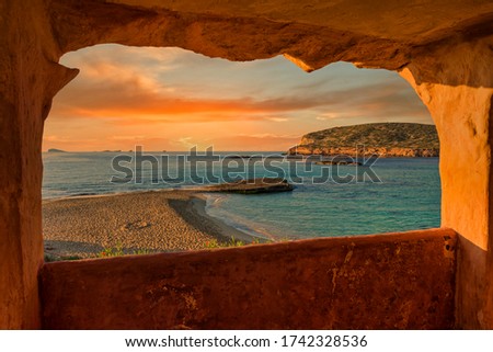 Window to Cala Comte de Ibiza at sunset, Spain Royalty-Free Stock Photo #1742328536