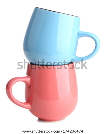 Blue and pink cups isolated on white