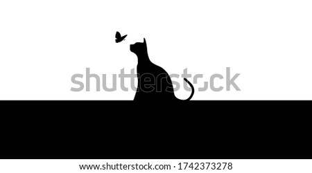 black silhouette of a cat with butterfly