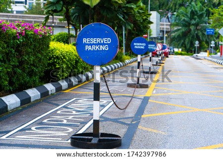 Parking blocked by signs parking reserved close up