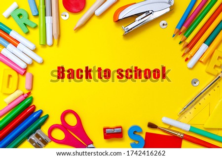 Modern back to school flatlay, great design for any purposes. Yellow table background. Learning concept. Design element. Education concept. Poster design. School kid. Flat lay.
