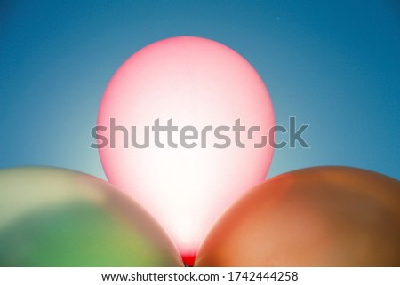 Artistic image of colorful birthday balloons in a minimalist style