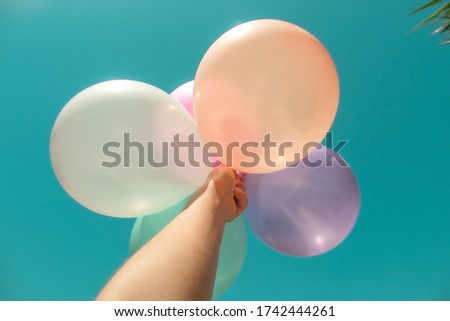 Artistic image of colorful birthday balloons in a minimalist style