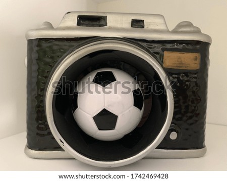 photo camera and soccer ball