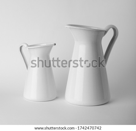 White watering pot on white