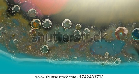 Abstract texture background. Acrylic color in water and oil. Macro.