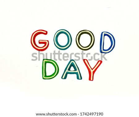 two words good and day consists of plasticine letters of different colors on a white background. plasticine modeling preschool education, mockup,layout for different ideas.