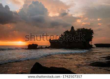 Temple in Bali. Tanah Lot water temple in Bali during sunset. Famous hindu temple main Bali landmark. Indonesia. Royalty-Free Stock Photo #1742507357
