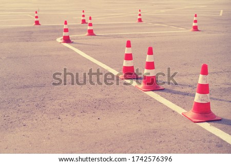 Red cones on a driving training and parallel parking area