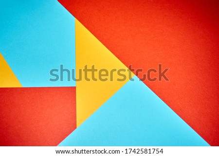 Colorful geometric texture paper pattern in yellow, blue, red