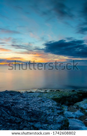 Cloudy summer sunset over ocean, Sweden