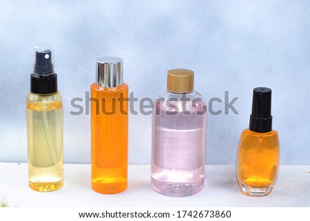 Spa ingredients, a set of cosmetic oils for skin and body care on a gray background. Shopping concept and modern woman, sale, selective focus, place for text