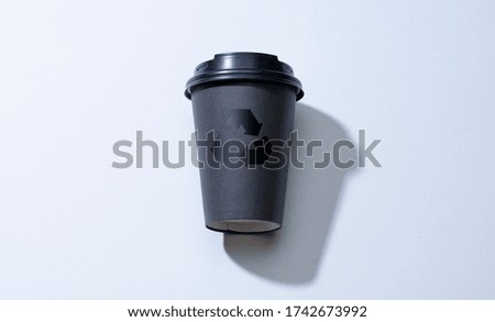 Black Stylish Takeaway Coffee Cup From Recyclable Cardboard With Recycle Arrow. Eco Friendly Production Concept