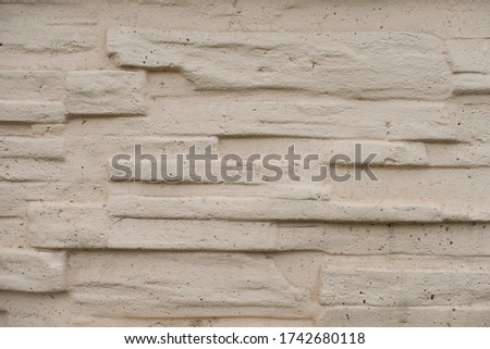Stone Tile Brick Wall Texture. yellow stone siding with different sized stones