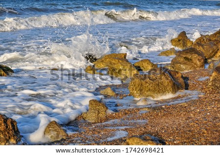Foaming waves washing the rocks