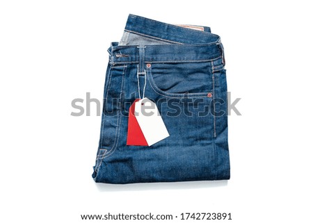 White and Red Blank Tag Price On Jeans. Copy Space. Empty Space. Promotion and Advertising