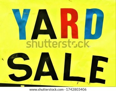 Colorful yard sale sign with large text