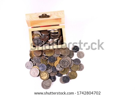 coint of currency on small shopping trolley. business, investment, financial and saving concept with isolated white background.