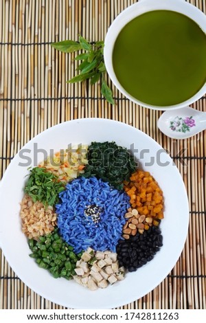 Lei cha or ground tea is a traditional Southern Chinese tea-based beverage or gruel. It is served with rice and other vegetarian side dishes such as greens, tofu, and pickled radish.           