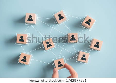 Building a strong team, Wooden blocks with people icon on blue background, Human resources and management concept. Royalty-Free Stock Photo #1742879351