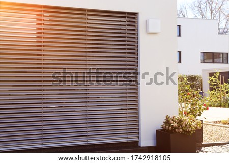 Window with modern blind, exterior shot Royalty-Free Stock Photo #1742918105