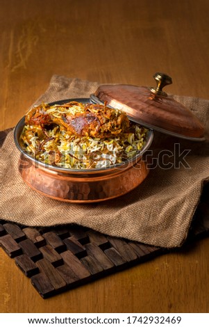 Hyderabadi Chicken Dum Biryani - Marinated chicken drumstick cooked with basmati rice and biryani spices Royalty-Free Stock Photo #1742932469