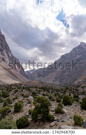 The beautiful mountain trekingtrekking road with clear blue sky and rocky hills in Fann mountains in Tajikistan