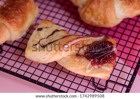 Handmade pastries.
Cupcakes, cakes, palmeritas, cheese bread. Pink image background. Kettle and items to accompany the mate or infusions such as tea and coffee