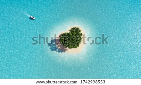 A heart-shaped paradise island in the middle of the ocean. Yacht approaching the island. Space for text