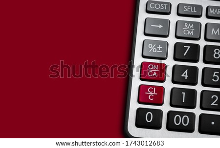 calculator on the red background.