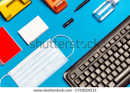 Work from home covid, Vivid and colourful desk with face mask in the office, work safe concept. homework