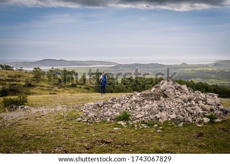 Whitbarrow is a hill in Cumbria, England. Designated a biological Site of Special Scientific Interest and national nature reserve, it forms part of the Morecambe Bay Pavements