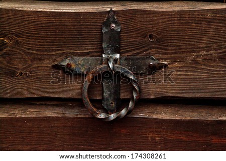 Old rusty gate latch on the door 