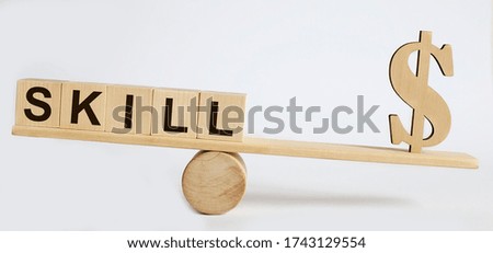 Text Skill on wood cube block, stock investment concept.